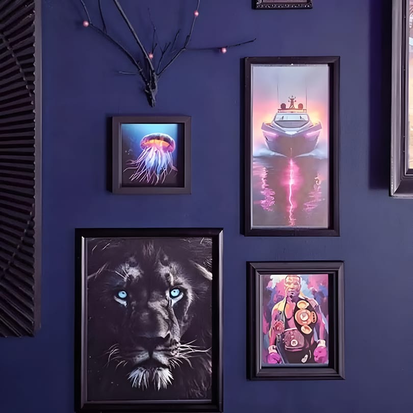 Dark blue wall adorned with framed art of a jellyfish, boat, lion, and boxer.